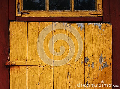 Closeup shot of a yellow door detail of a typical Swedish wood house Stock Photo