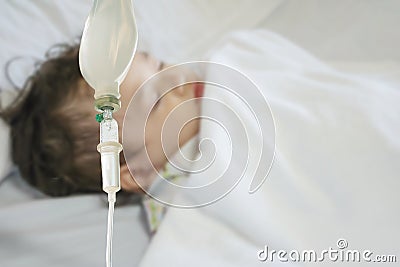 Closeup sick child sleep on hospital bed textured background with copy space Stock Photo