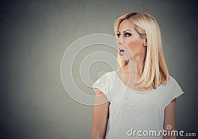 Closeup side view profile portrait woman talking with open mouth Stock Photo