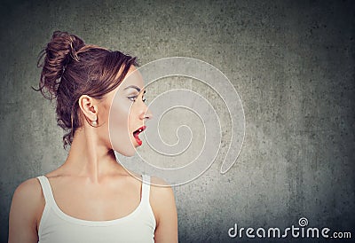 Closeup side view profile portrait woman talking with open mouth Stock Photo