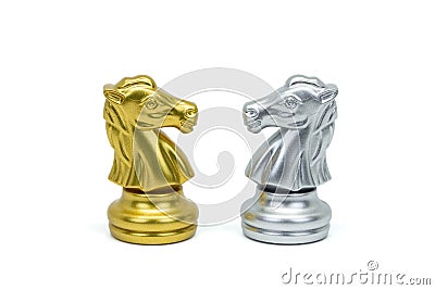 Closeup silver and gold horse chess pieces in a row isolated on white background. Clipping path Stock Photo