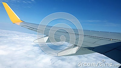 Aircraft wing above the clouds Stock Photo