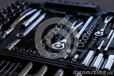 Closeup of a silver set of wrenches, nuts and bolts for changing wheels in the garage Stock Photo