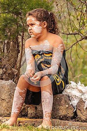 Closeup of sitting young Aboriginal girl in Newcastle, Australia Editorial Stock Photo