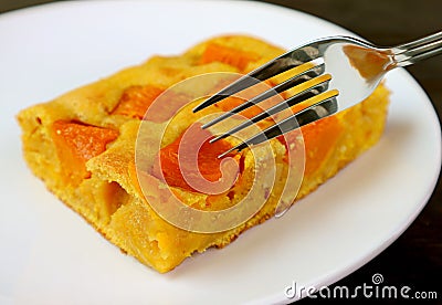 Closeup a Slice of Tasty and Healthy Homemade Butternut Squash Cake Bar on a White Plate Stock Photo