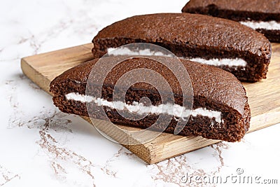 Closeup slices chocolate vanilla cream cake Stock Photo