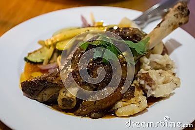 Slow Roasted Lamb Shank Stock Photo