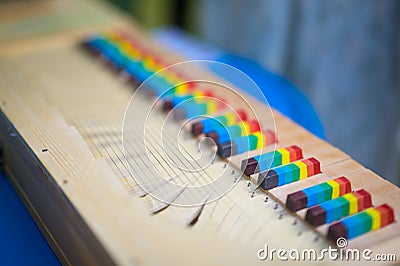 Closeup of a small clavichord with colorful keys Stock Photo