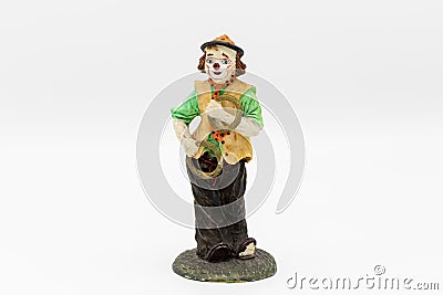 Figurine of a juggling clown white background Stock Photo