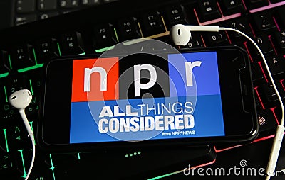 Closeup of smartphone screen with logo lettering of independant online radio broadcast service npr on computer keyboard Editorial Stock Photo