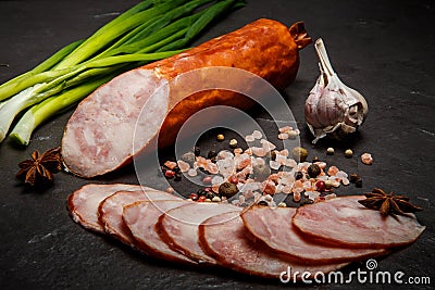 closeup smoked ham sausage with garlic and green onions Stock Photo