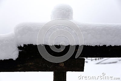 Fabulous winter landscape with fresh snow on rural wooden fence Stock Photo