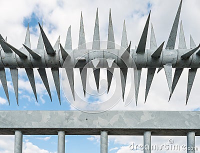 Closeup spiked fence Stock Photo