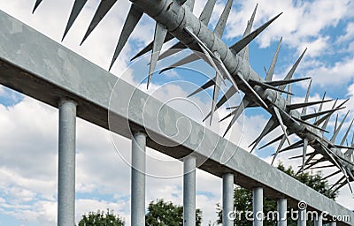 Closeup spiked fence Stock Photo