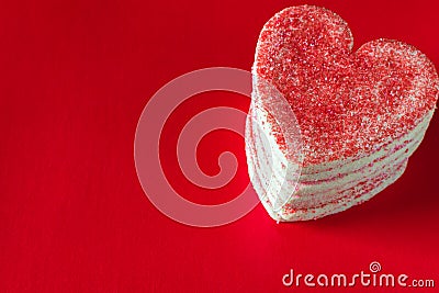 Stacked heart shaped valentines cookies on red background Stock Photo