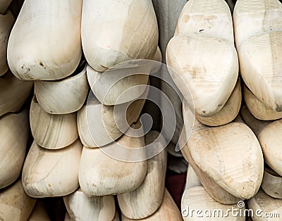 Closeup of a stack of traditional Dutch wooden clogs Stock Photo