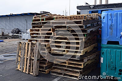 Closeup of stacked pallet boards outside on the pier Stock Photo