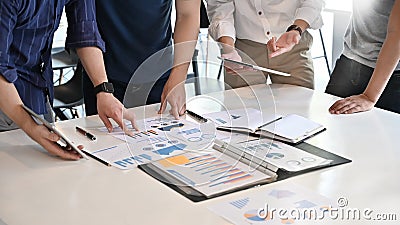 Closeup startup business concept, Team business meeting and analysis financial data on document paper. Stock Photo