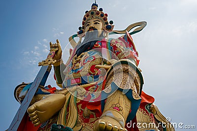 Closeup of statue of taoist god Xuan Tian Shang Di at lotus pond Stock Photo