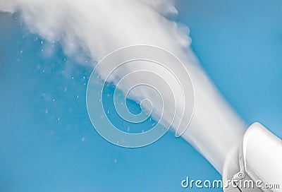 closeup steam from the air humidifier on blue background. health, disease prevention Stock Photo