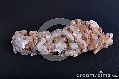 Closeup of a stilbite mineral piece on the dark blurred background Stock Photo