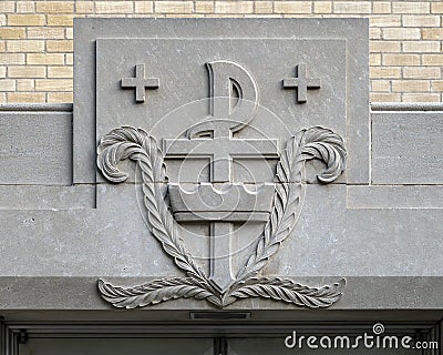 Closeup of stone carving above the side entrance to the narthex on the North side of Christ the King Church in Dallas, Texas. Editorial Stock Photo