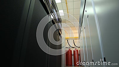 Closeup Storage Center Data with Fire Extinguisher. Closeup camera moves along the storage center data with fire extinguisher in front Closeup Storage Center Data with Fire Extinguisher. Closeup camera moves along the storage center data with fire extinguisher in front