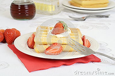 Closeup strawberries whipped cream waffles Stock Photo