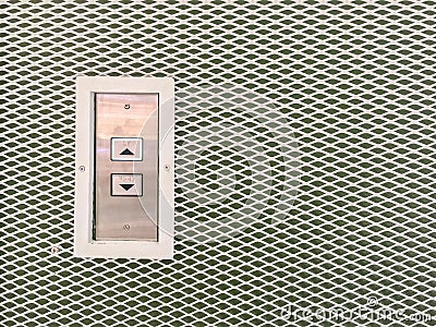 Closeup surface elevator button in up and down arrow sign on steel wall textured background with copy space Stock Photo