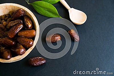 Closeup sweet dried date palm fruits or kurma, ramadan ramazan food. Natural light. Selective focus. Close up on a Stock Photo