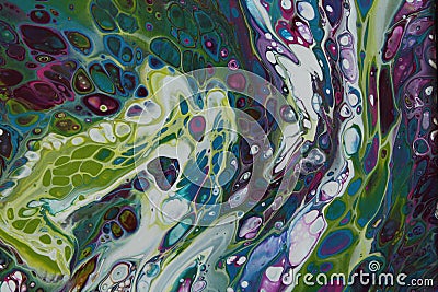 Closeup of a swirling abstract acrylic pour painting with blending greens, blues, and purples. Stock Photo