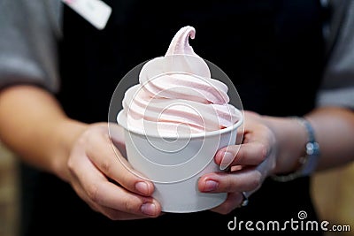 Closeup of takeaway cup with organic frozen yogurt ice cream Stock Photo