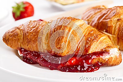 Closeup of tasty fresh appetizing croissants with fruit jam, cot Stock Photo