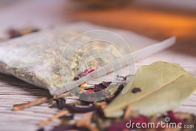 Closeup of a tea bag on a wooden table Stock Photo