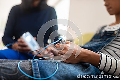 Closeup of teenage girl holding zapper electrodes Stock Photo