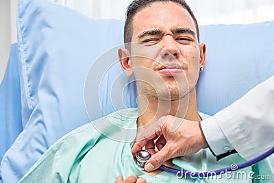 Closeup, Teenage Male Patient on bed in hospital room Stock Photo