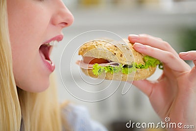 Closeup on teenager girl eating burger Stock Photo