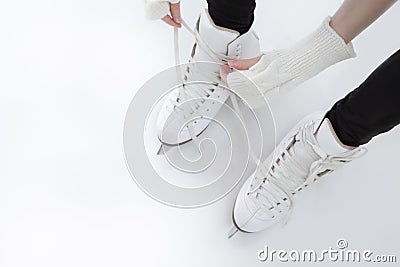 Closeup of Teenager Girl hands Lacing Up Iceskates Stock Photo