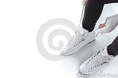 Closeup of Teenager Girl hands Lacing Up Iceskates Stock Photo