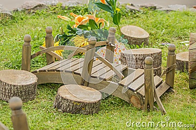 Closeup of tiny wooden bridge. Garden decoration Stock Photo