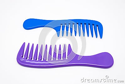 Closeup to Blue and Purple Plastic Comb, Isolated Stock Photo