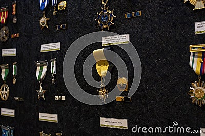 Closeup to a colombian police condecorations with their respective description Editorial Stock Photo