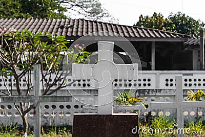 Closeup to Crucifix Symbol of Christian Graveyard Stock Photo