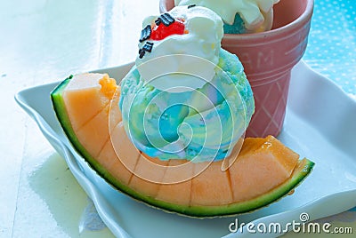 Closeup to Fresh Melon with Rainbow Ice Cream Stock Photo