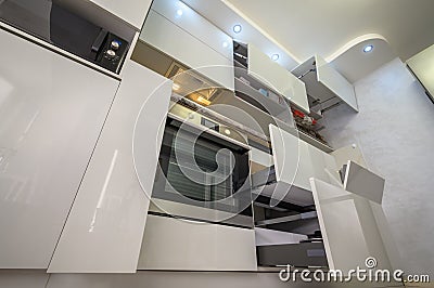 Closeup to furniture details of modern trendy white kitchen Stock Photo