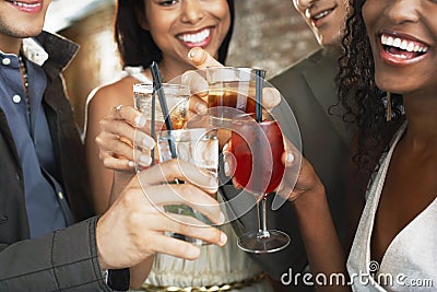 Closeup Of Toasting Drinks At Bar Stock Photo