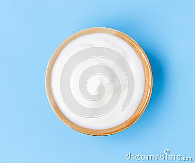 Closeup top view greek yogurt bowl with blue background Stock Photo