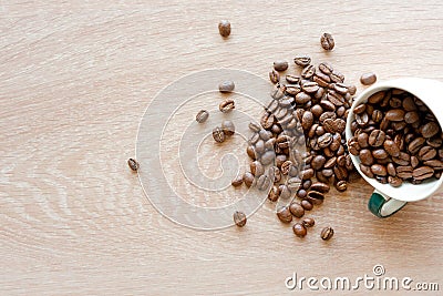 Closeup top view of many coffee beans in the ceramic mug with copy space for adding some text Stock Photo