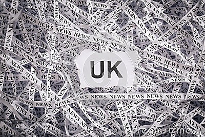 Closeup torn pieces and tapes of paper with the word UK. Stock Photo