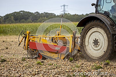 Closeup of grubbing machine behind tractor Editorial Stock Photo